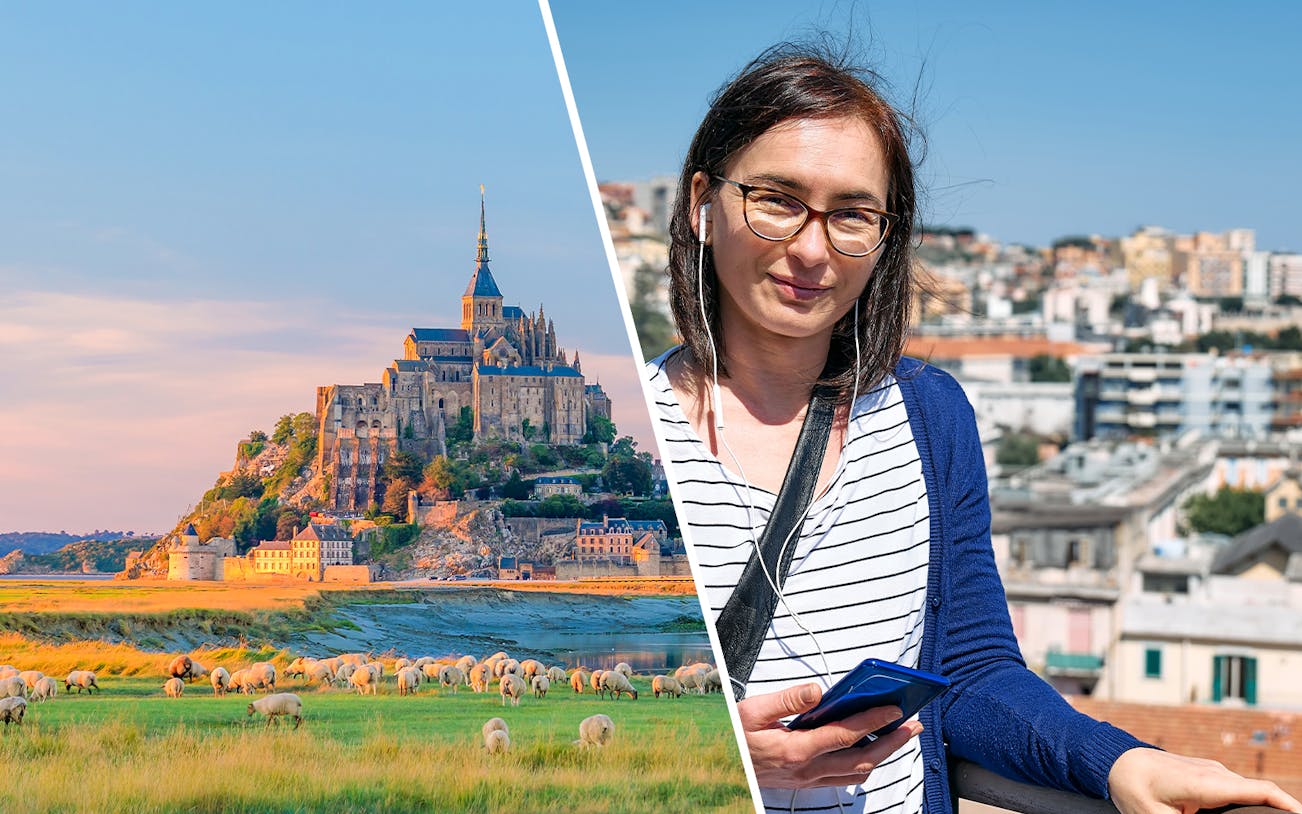 Mont Saint-Michel with abbey and visitor using audio guide.