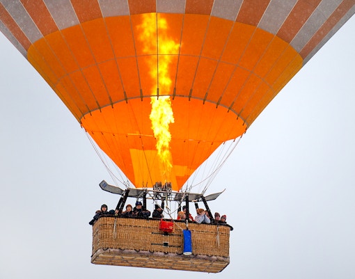 Passengers in the basket of the hot air balloon