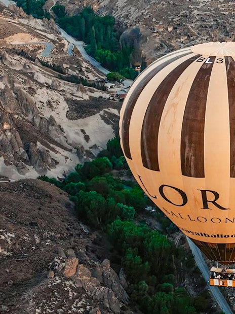 Two hot air balloons floating over Soganli Valley in Cappadocia.