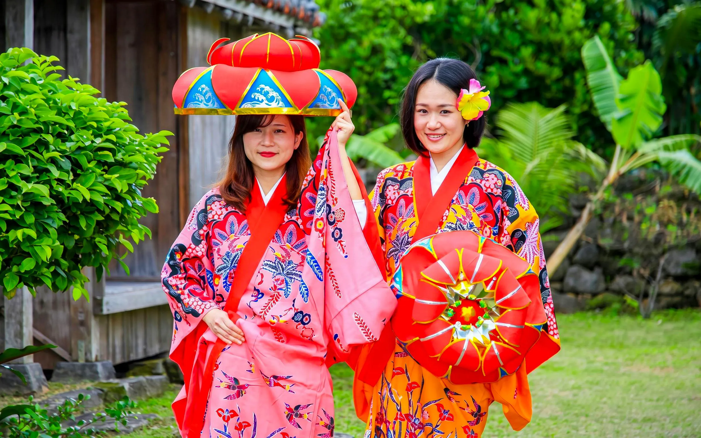 Women in traditional Ryukyu attire at Ishigaki Yaima Village, Okinawa.