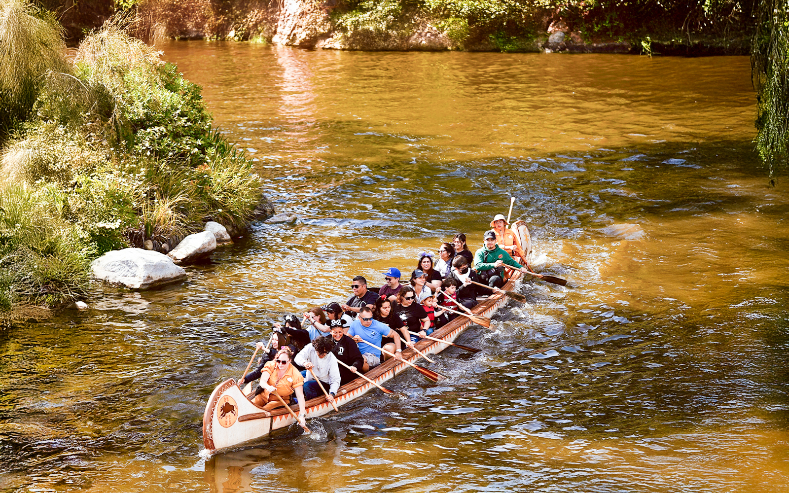 Visitors paddling Davy Crockett’s Explorer Canoes at Disneyland, California.