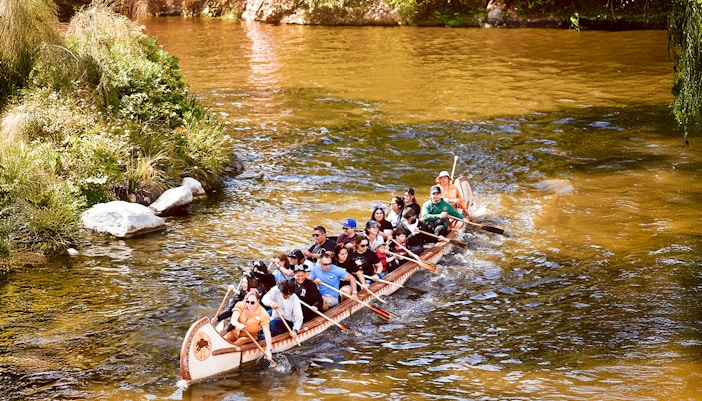 Visitors paddling Davy Crockett’s Explorer Canoes at Disneyland, California.