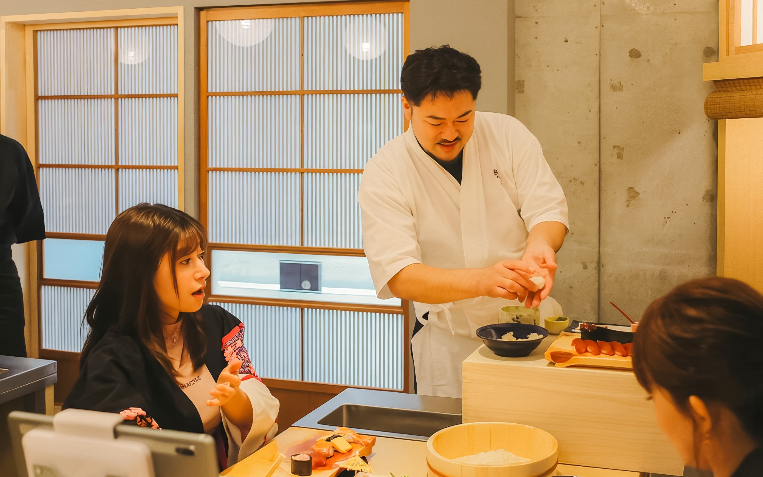 Chef instructing sushi-making class near Tokyo Tower.