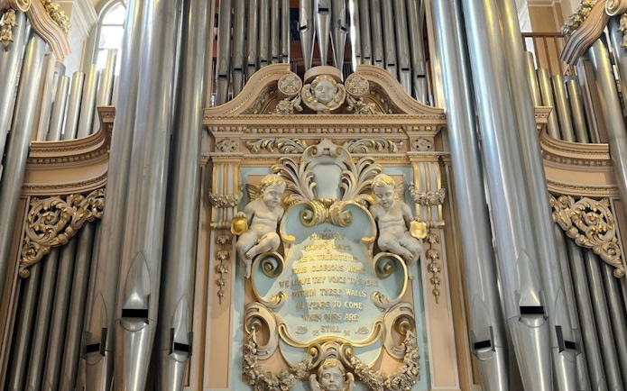 Blenheim Palace organ pipes and ornate carvings in the interior.