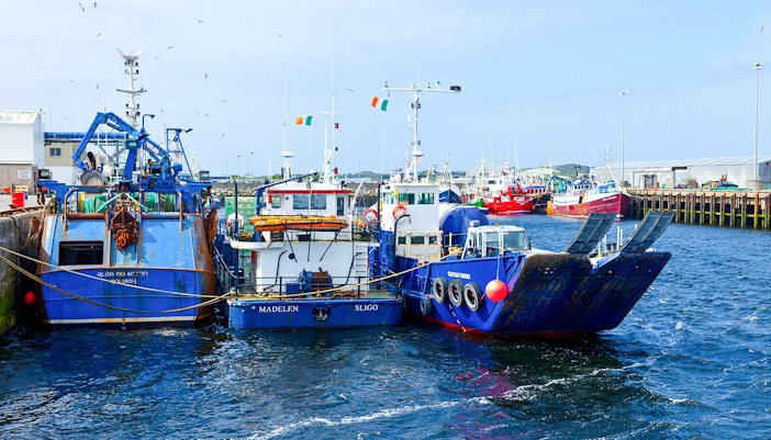 Fishing boats docked at Rossaveal harbor in Ireland.