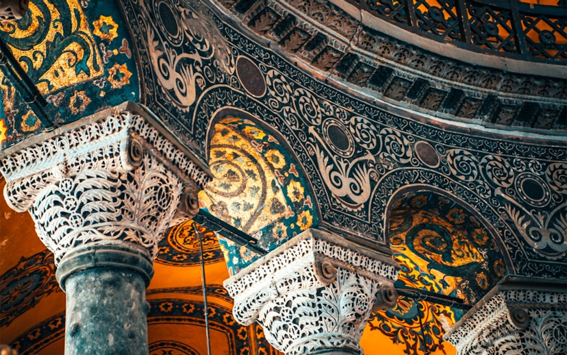 Hagia Sophia interior with ornate columns and intricate mosaics, Istanbul, Turkey.