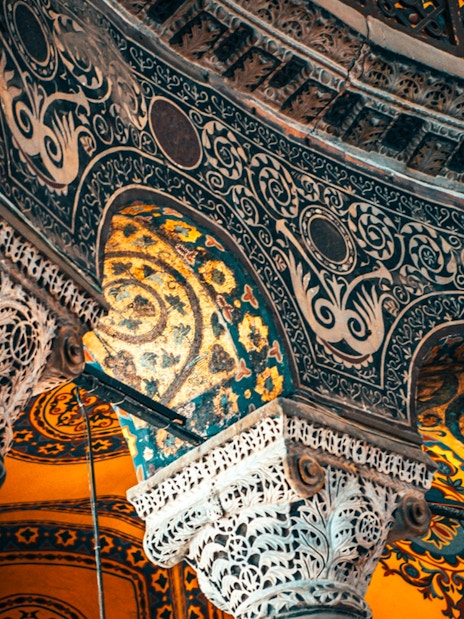 Hagia Sophia interior with ornate columns and intricate mosaics, Istanbul, Turkey.