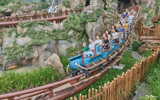 Roller coaster ride at Frozen Ever After, Disneyland Hong Kong, with passengers enjoying the thrill.