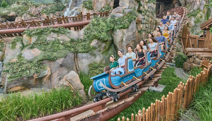 Roller coaster ride at Frozen Ever After, Disneyland Hong Kong, with passengers enjoying the thrill.