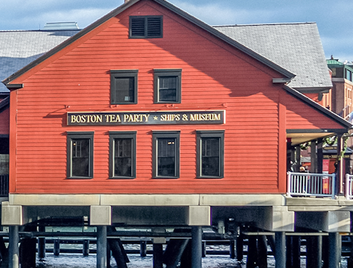 Boston Tea Party Ships & Museum red building on waterfront, Boston.