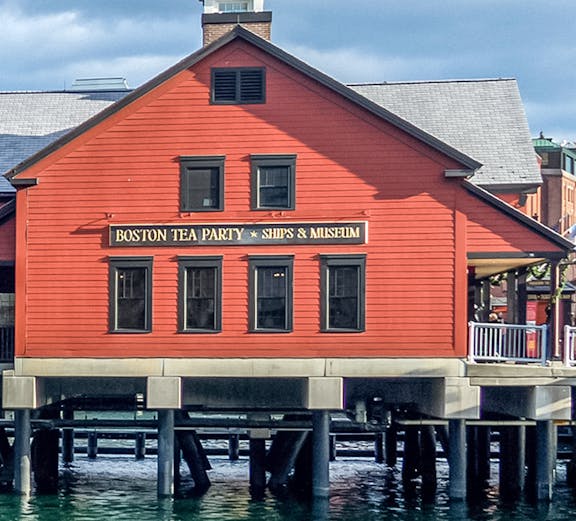 Boston Tea Party Ships & Museum red building on waterfront, Boston.