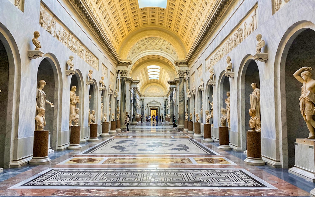 Vatican Museums gallery with classical sculptures, part of Combo: Vatican Museums & Sistine Chapel + Roma Pass.