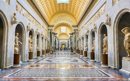 Vatican Museums gallery with classical sculptures, part of Combo: Vatican Museums & Sistine Chapel + Roma Pass.