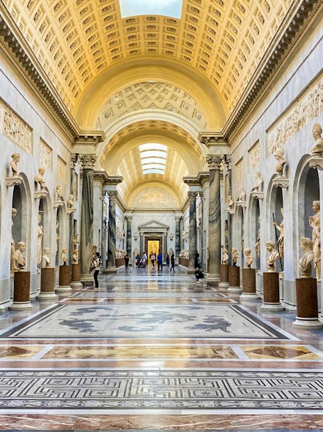 Vatican Museums gallery with classical sculptures, part of Combo: Vatican Museums & Sistine Chapel + Roma Pass.