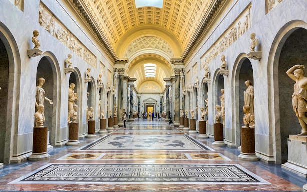 Vatican Museums gallery with classical sculptures, part of Combo: Vatican Museums & Sistine Chapel + Roma Pass.