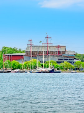 Vasa Museum on Djurgarden island, Stockholm, Sweden, with boats docked nearby.