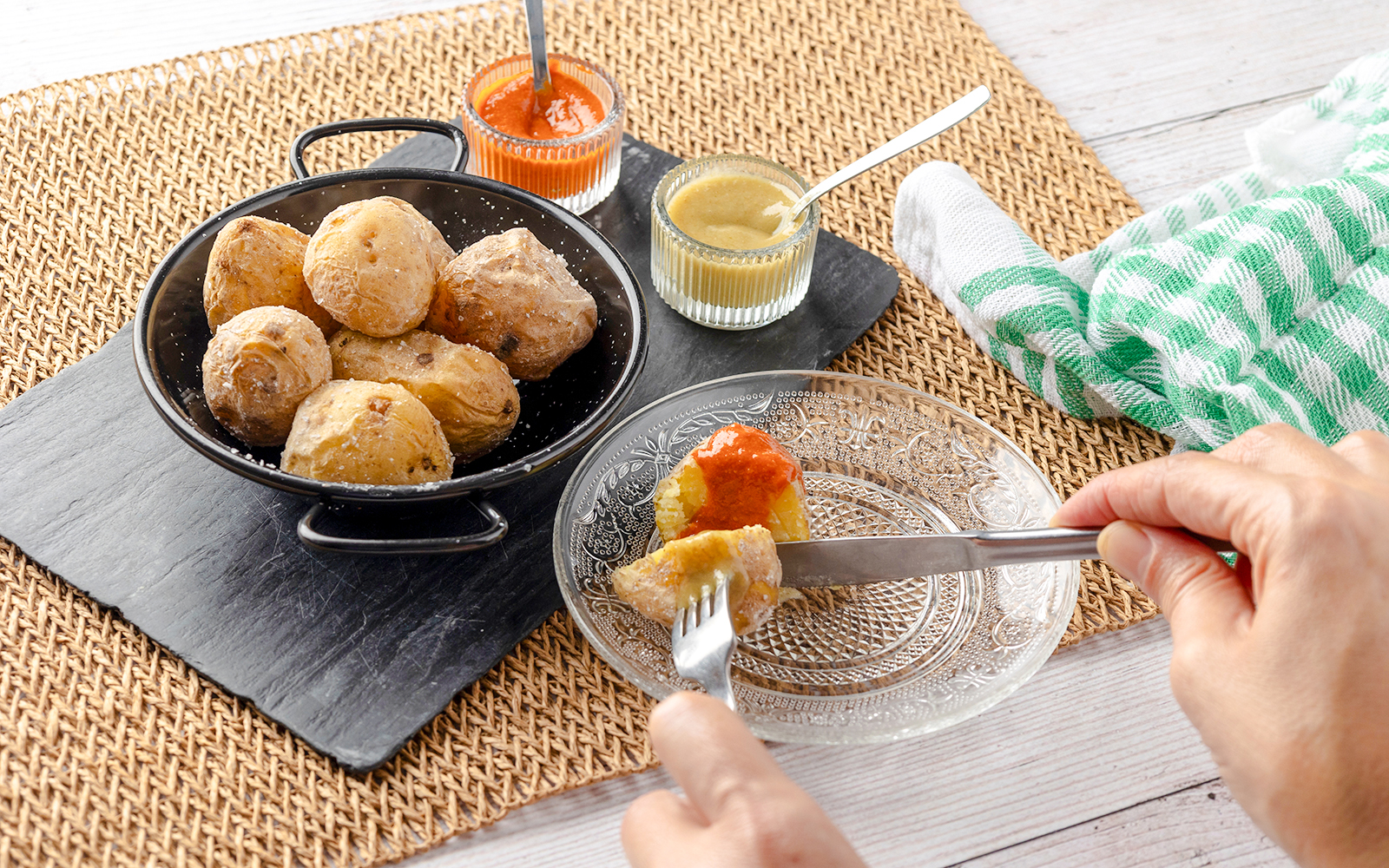 Salted Canarian potatoes with red and green mojo sauces in Tenerife.