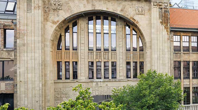 Historic building facade of Fotografiska museum in Berlin with scaffolding.