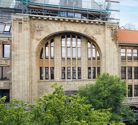 Historic building facade of Fotografiska museum in Berlin with scaffolding.