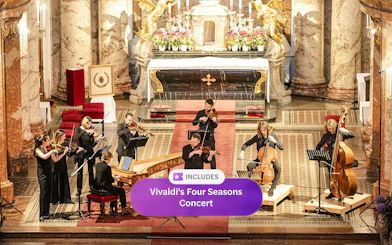 Musicians performing Vivaldi's Four Seasons in an ornate concert hall.