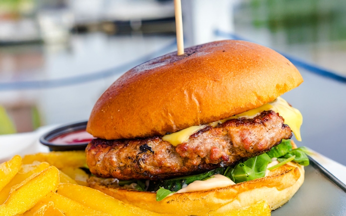 Burger with fries served on Camira Sailing Adventure, Airlie Beach.