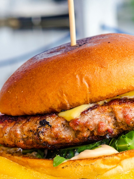 Burger with fries served on Camira Sailing Adventure, Airlie Beach.
