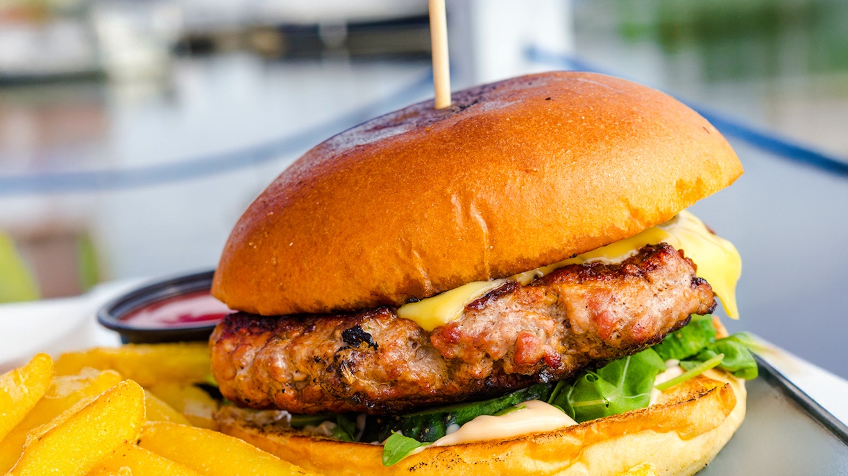 Burger with fries served on Camira Sailing Adventure, Airlie Beach.