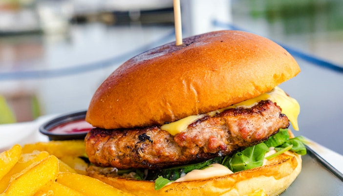 Burger with fries served on Camira Sailing Adventure, Airlie Beach.