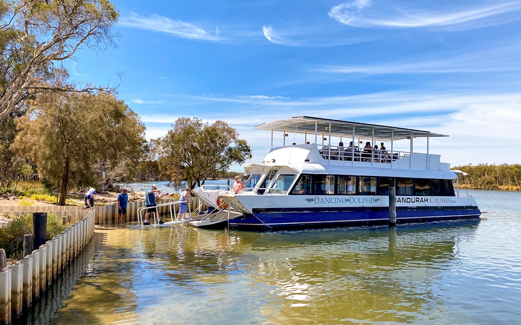 Cruise boat docked on the Murray River with passengers boarding for a lunch tour.