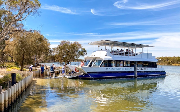 Cruise boat docked on the Murray River with passengers boarding for a lunch tour.