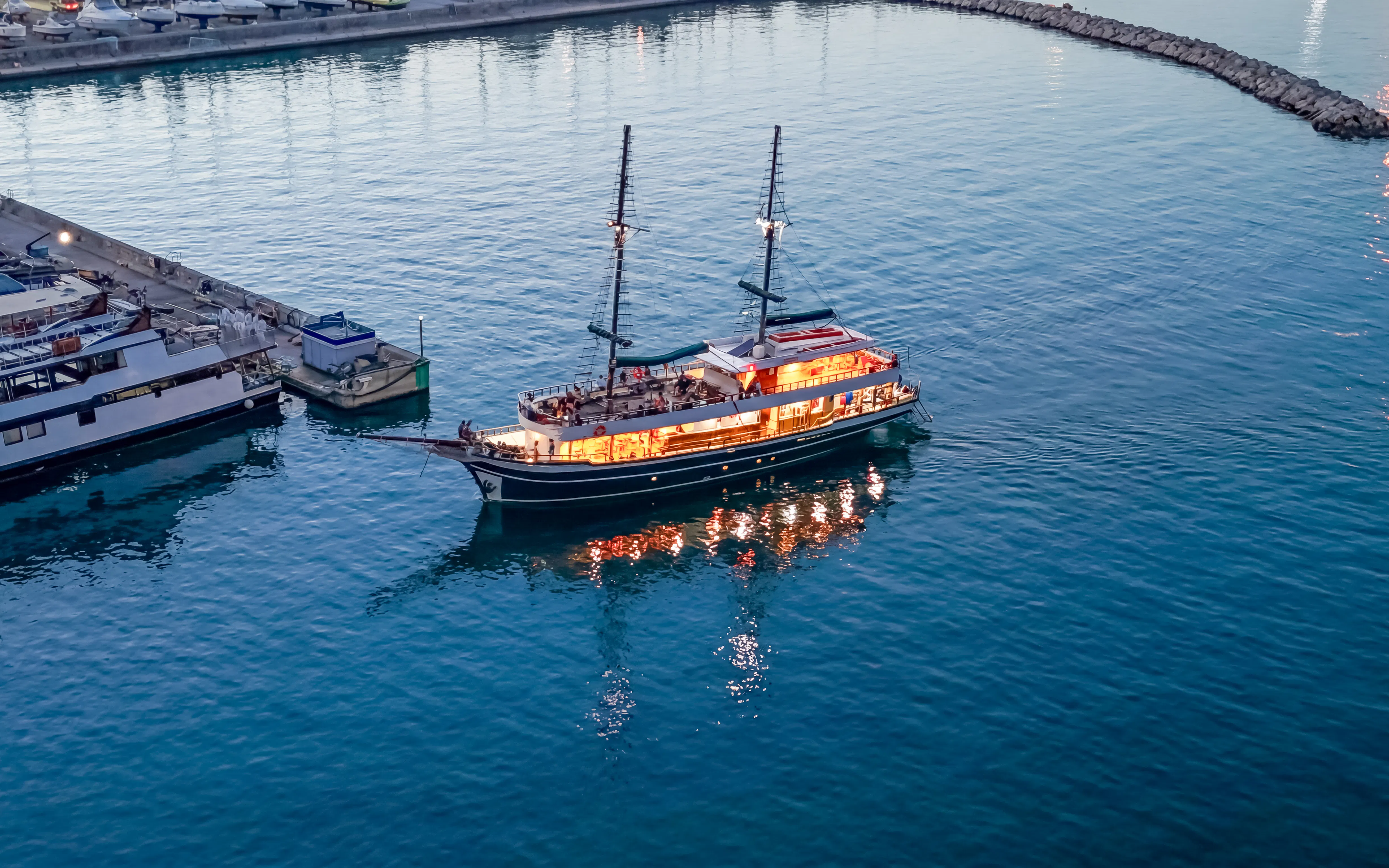 Sunset cruise ship departing Ayia Napa harbor for Blue Lagoon tour.