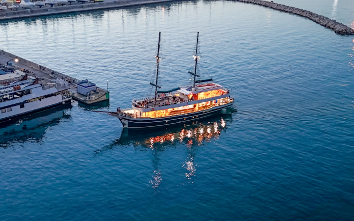 Sunset cruise ship departing Ayia Napa harbor for Blue Lagoon tour.
