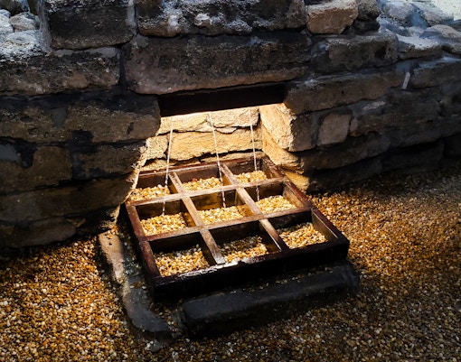 Fountain of Youth spring with water flowing through stone structure, St Augustine, Florida.