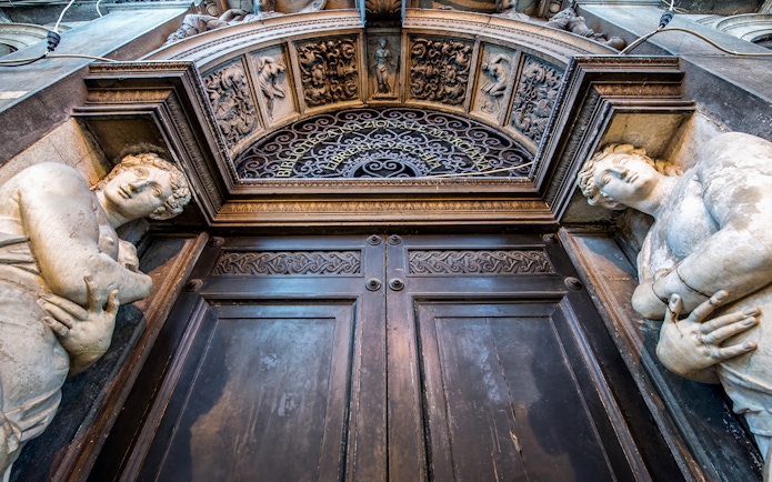 Entrance of Biblioteca Nazionale Marciana in Venice with ornate sculptures.