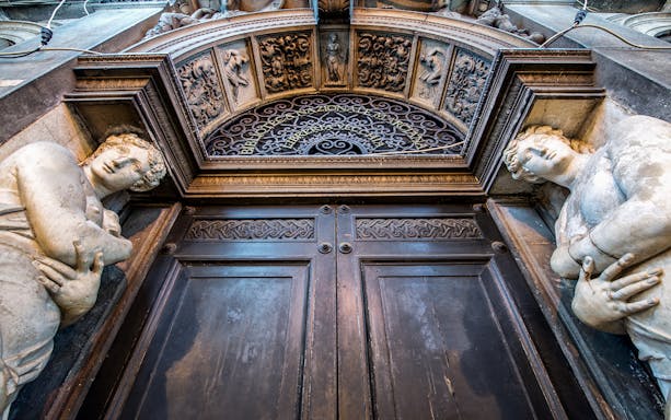 Entrance of Biblioteca Nazionale Marciana in Venice with ornate sculptures.