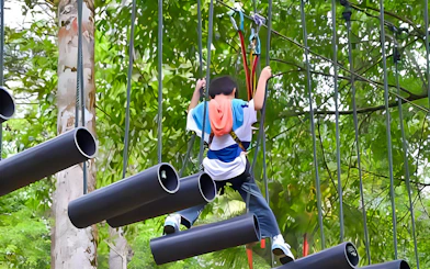 Person navigating obstacle course at Skytrex Adventure Langkawi.