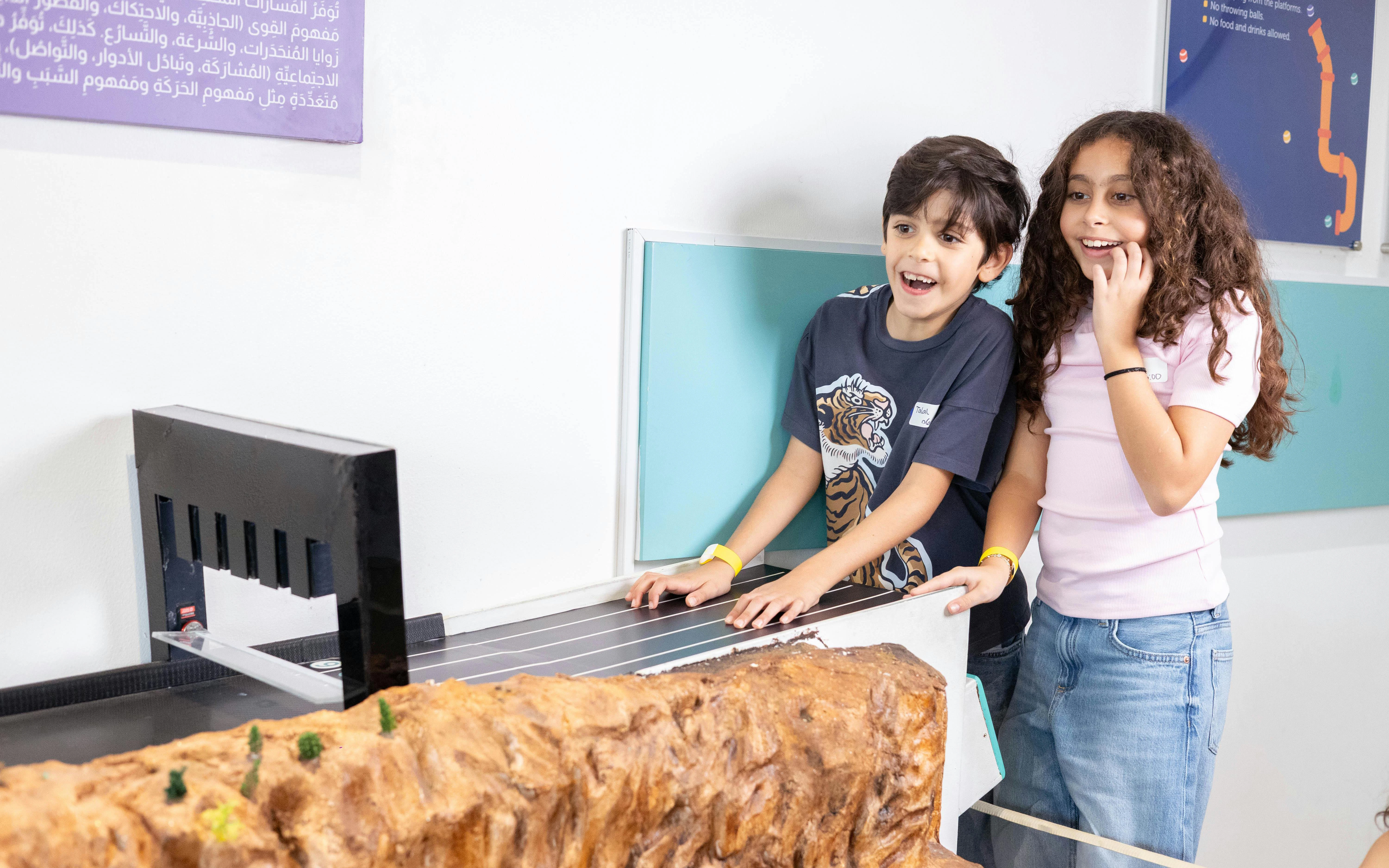 Children engaging with an interactive exhibit at OliOli Children's Museum.