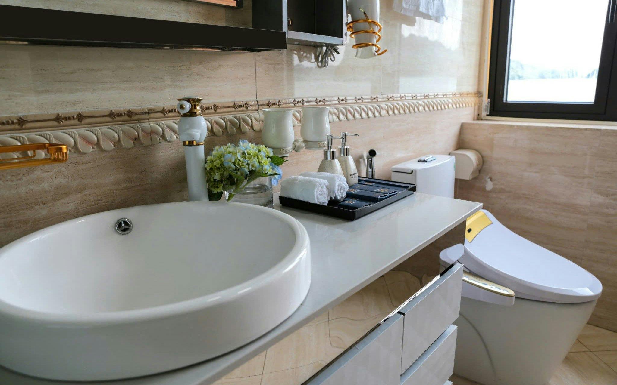 Luxurious bathroom on Lan Ha Bay 3-4 star cruise with modern amenities.