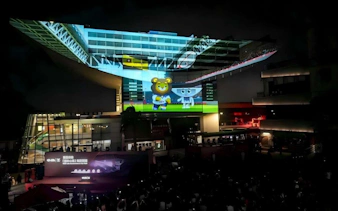 Hong Kong Peak Tram station with evening light show projection.