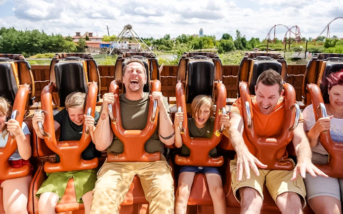 Guests on a thrill ride at BELANTIS Adventure Park, Germany, enjoying the experience.