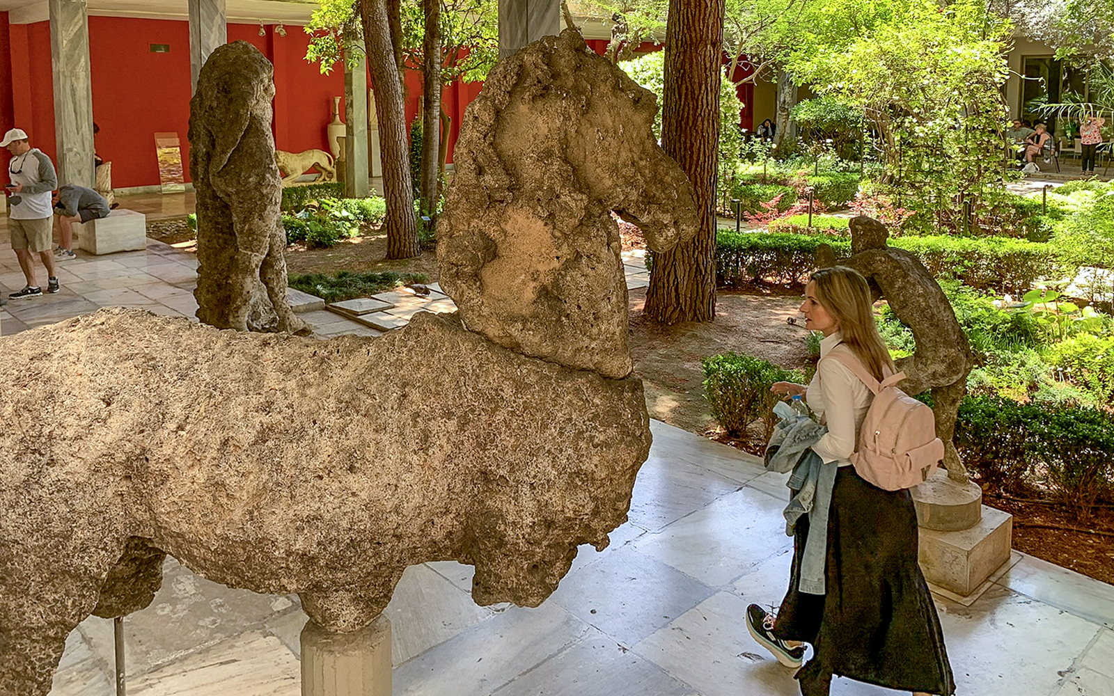 Guests viewing ancient sculptures in the garden of the National Archaeological Museum.