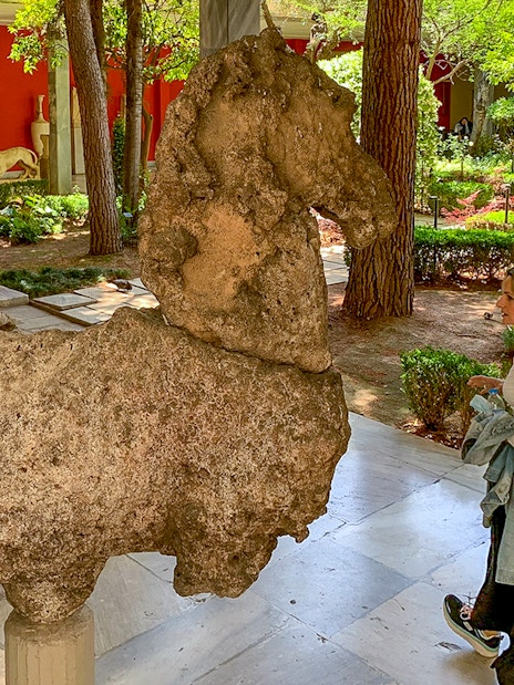 Guests viewing ancient sculptures in the garden of the National Archaeological Museum.
