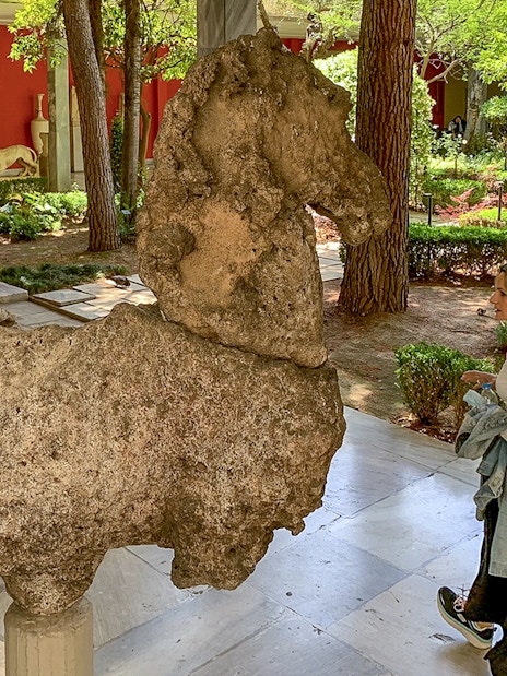 Guests viewing ancient sculptures in the garden of the National Archaeological Museum.