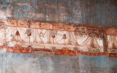 Herculaneum frescoes with detailed red and white drapery patterns.