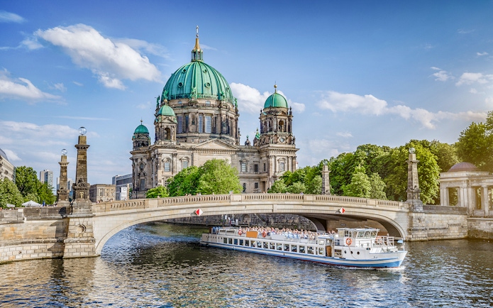 Berlin Cathedral with a cruise boat on the Spree River, part of the Berlin TV Tower and city cruise tour.
