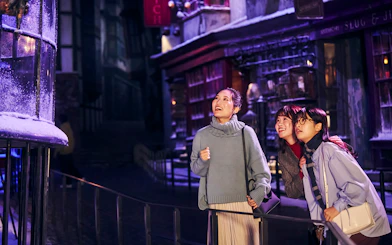 Visitors enjoying Diagon Alley at Christmas during The Making of Harry Potter Studio Tour in Tokyo.