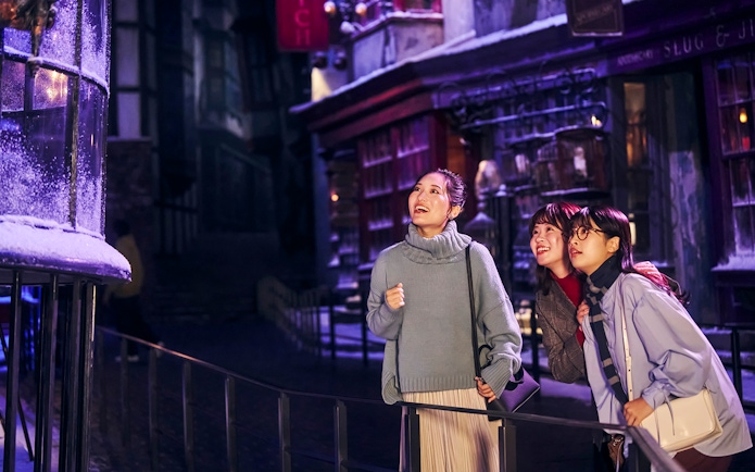 Visitors enjoying Diagon Alley at Christmas during The Making of Harry Potter Studio Tour in Tokyo.