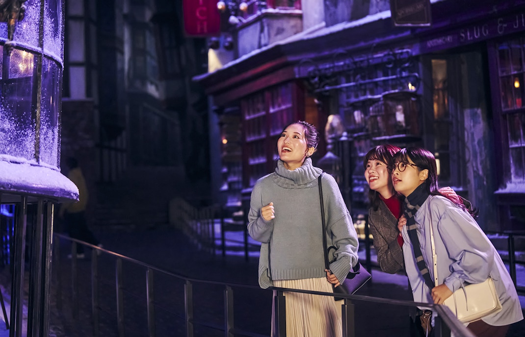 Visitors enjoying Diagon Alley at Christmas during The Making of Harry Potter Studio Tour in Tokyo.