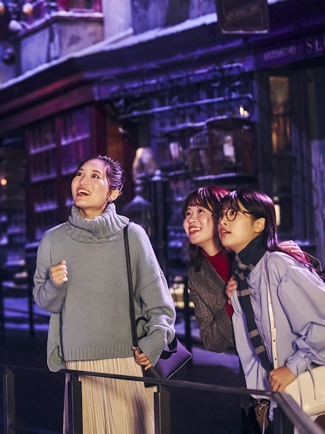 Visitors enjoying Diagon Alley at Christmas during The Making of Harry Potter Studio Tour in Tokyo.