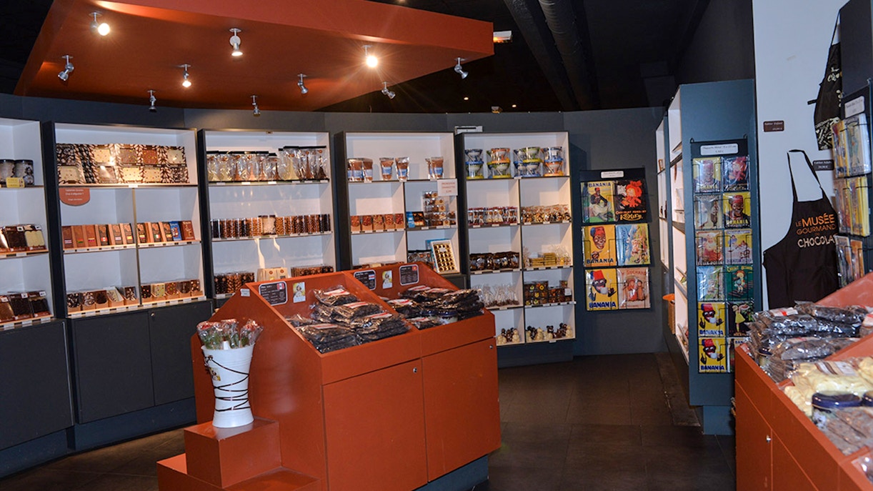 Choco-Story Paris interior with chocolate displays and merchandise shelves.